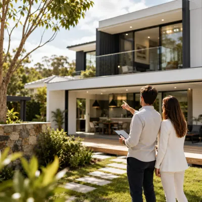 Buyers agent guiding a property buyer through the exterior features of a modern Australian home during a detailed property inspection.