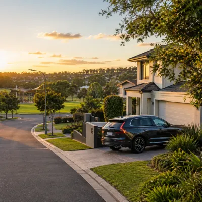 Luxury family home in Carindale with a premium SUV, landscaped garden and nearby park, representing the suburb’s family-friendly lifestyle and residential appeal.
