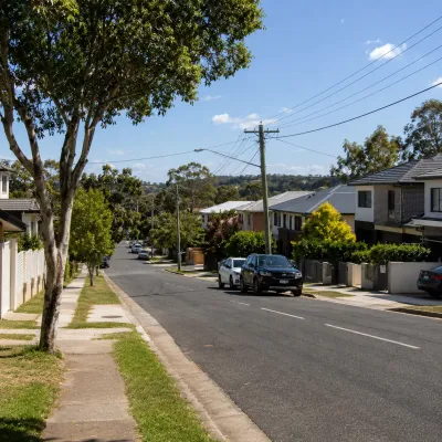 Residential street in Mount Gravatt with modern houses and established homes, representing local investment and student-housing property opportunities.