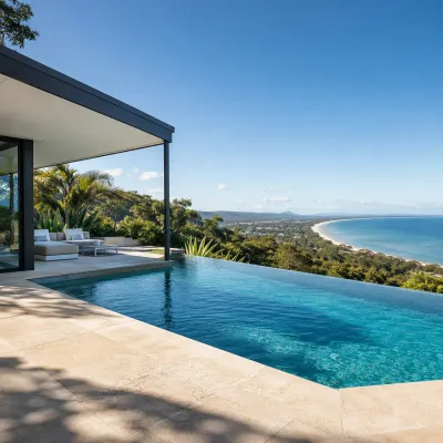Luxury Noosa Heads home with an infinity pool overlooking the coastline, representing the area’s prestige property market and premium coastal lifestyle.