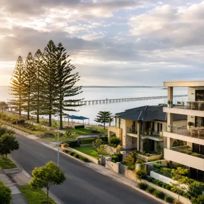 Redcliffe waterfront homes, foreshore park and long pier overlooking Moreton Bay, representing the peninsula’s lifestyle appeal and property investment potential.
