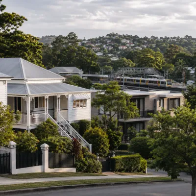 Toowong and Taringa hillside homes with nearby rail access and leafy western Brisbane streets, representing the area’s residential lifestyle and strong connectivity.