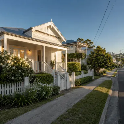 Traditional Queensland-style homes along a quiet Woolloongabba street, showing a leafy residential neighbourhood near the Olympic precinct.